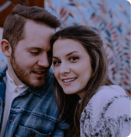 A couple and the smiling woman